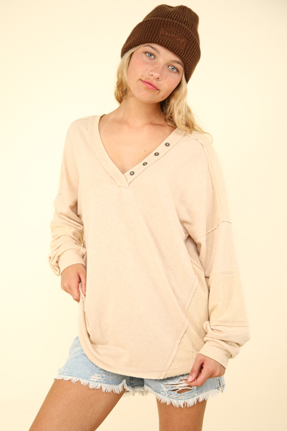 VERY J Here There And Everywhere Washed V-Neck Exposed Seam Knit Top in Beige
