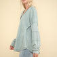 VERY J Here There And Everywhere Washed V-Neck Exposed Seam Knit Top in Sage