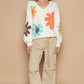 POL Flowers in my Heart V-Neck Long Sleeve Flower Fringe Sweater in Ivory