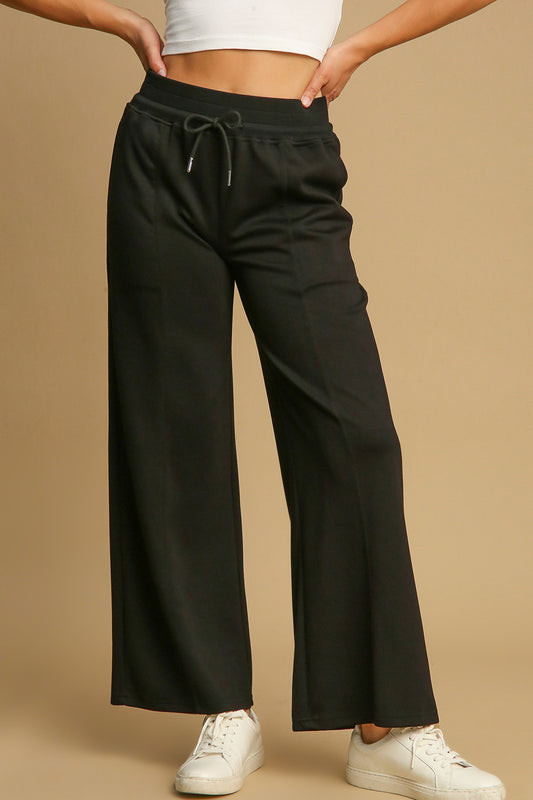 Umgee Too Glam To Give A Damn Drawstring Wide Leg Pants with Pockets in Black