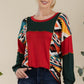 Celeste Simplicity with a Twist Exposed Seam Printed Color Block T-Shirt in Red
