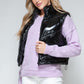 Snobbish A Quilted Touch Zip Up Turtleneck Shiny Quilted Vest in Black
