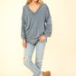 VERY J Here There And Everywhere Washed V-Neck Exposed Seam Knit Top in Denim