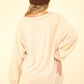 VERY J Here There And Everywhere Washed V-Neck Exposed Seam Knit Top in Beige