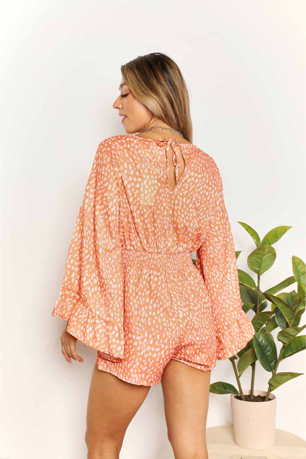 Double Take Time Flies Flare Sleeve Printed Surplice Romper